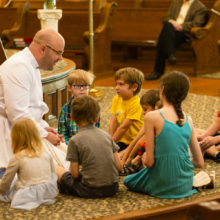 Associate Minister Bobby with children